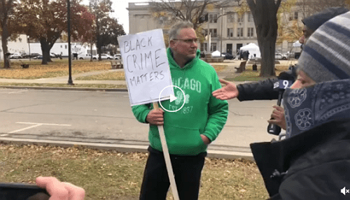 White Man Outside Kyle Rittenhouse Trial Holds Up ‘Black Crime Matters’ Sign While Arguing That The N-Word Is OK